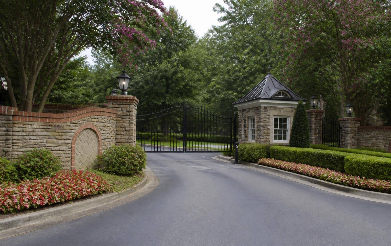 Gated stone and iron entrance to the Ballantyne Country Club community