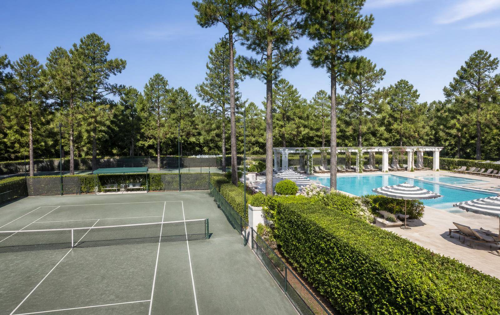 Tennis courts and resort-style pool at the club's racquet and aquatics campus